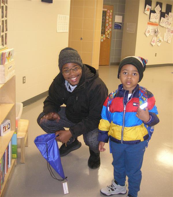 Picking out a new Lending Library book with dad!